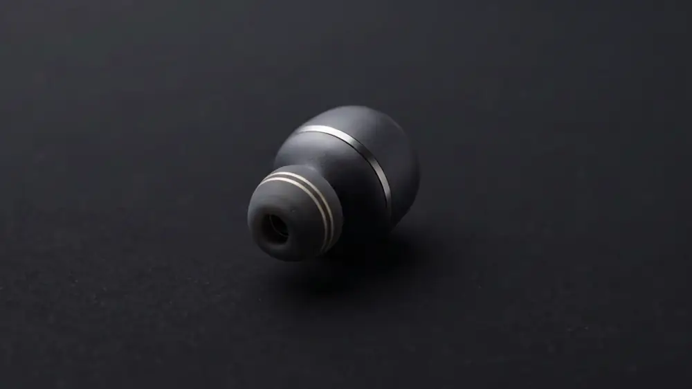 Signalive earbud with its metal contact rings set into the silicone eartip